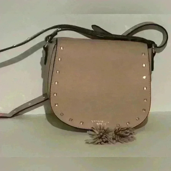 Victoria's Secret Handbags - A Victoria’s Secret light pink crossbody bag w/ tassels.